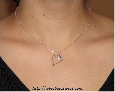 Dancing Heart Pendant with Faceted CZ