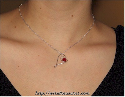 Dancing Heart Pendant with Red Crystal Bead