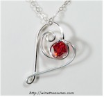 Dancing Heart Pendant with Red Crystal Bead